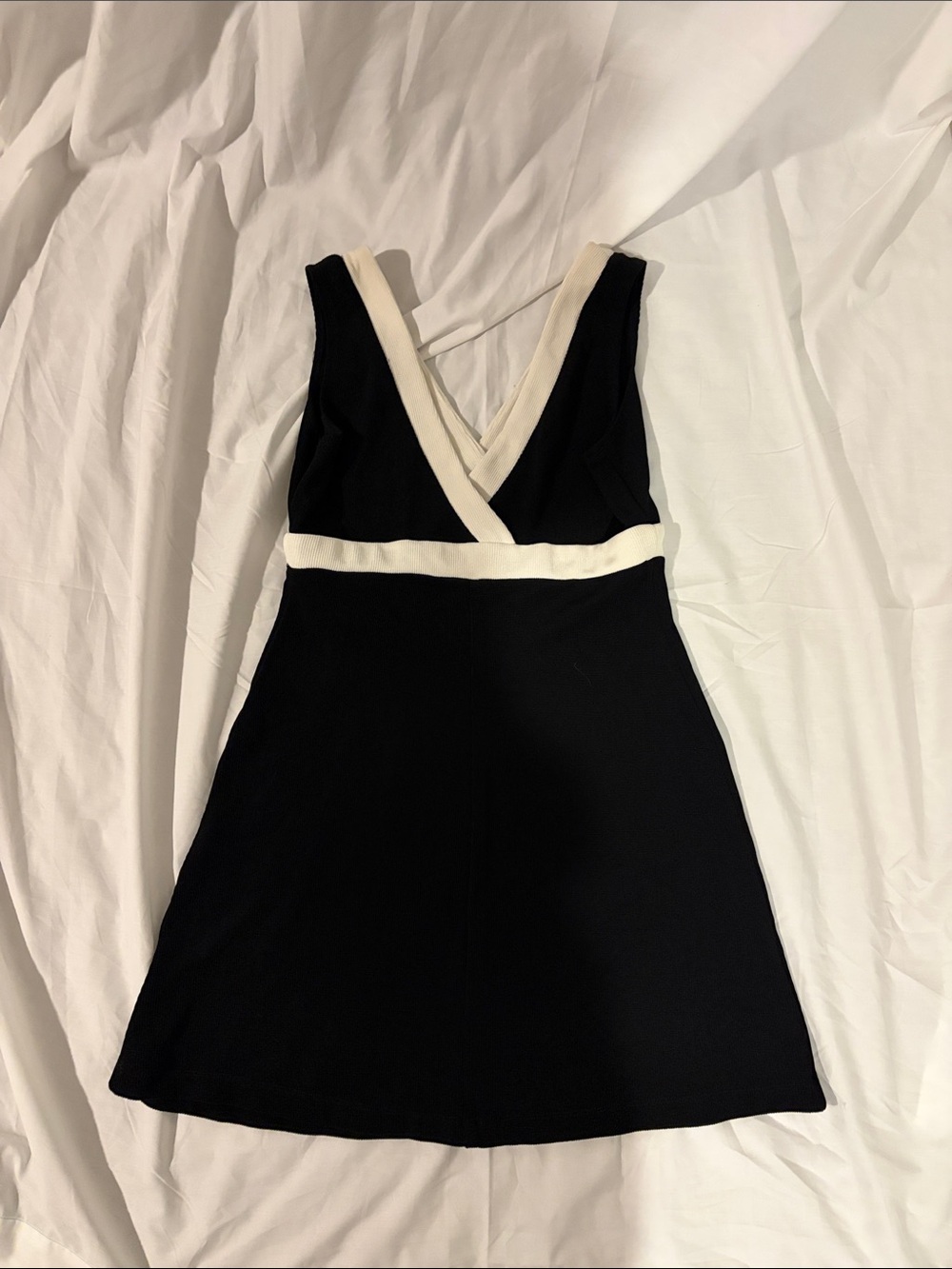 Chic Black Mini Dress with Cream Trim